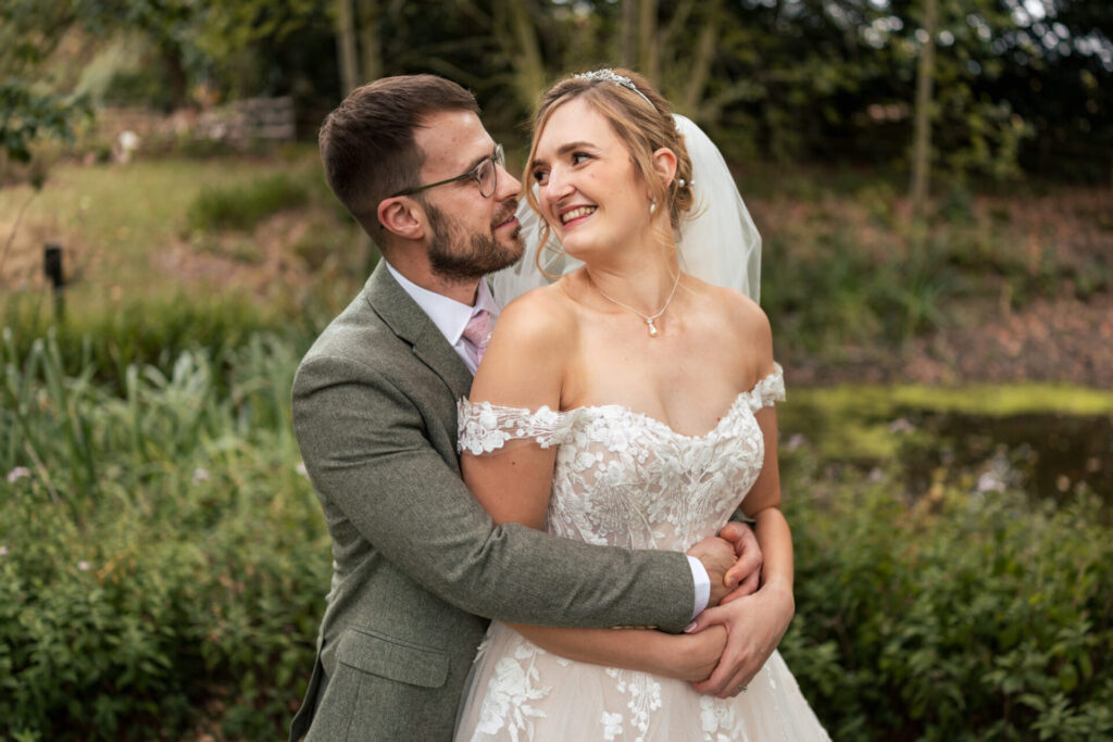 Bride and groom hugging for a personalised fun wedding